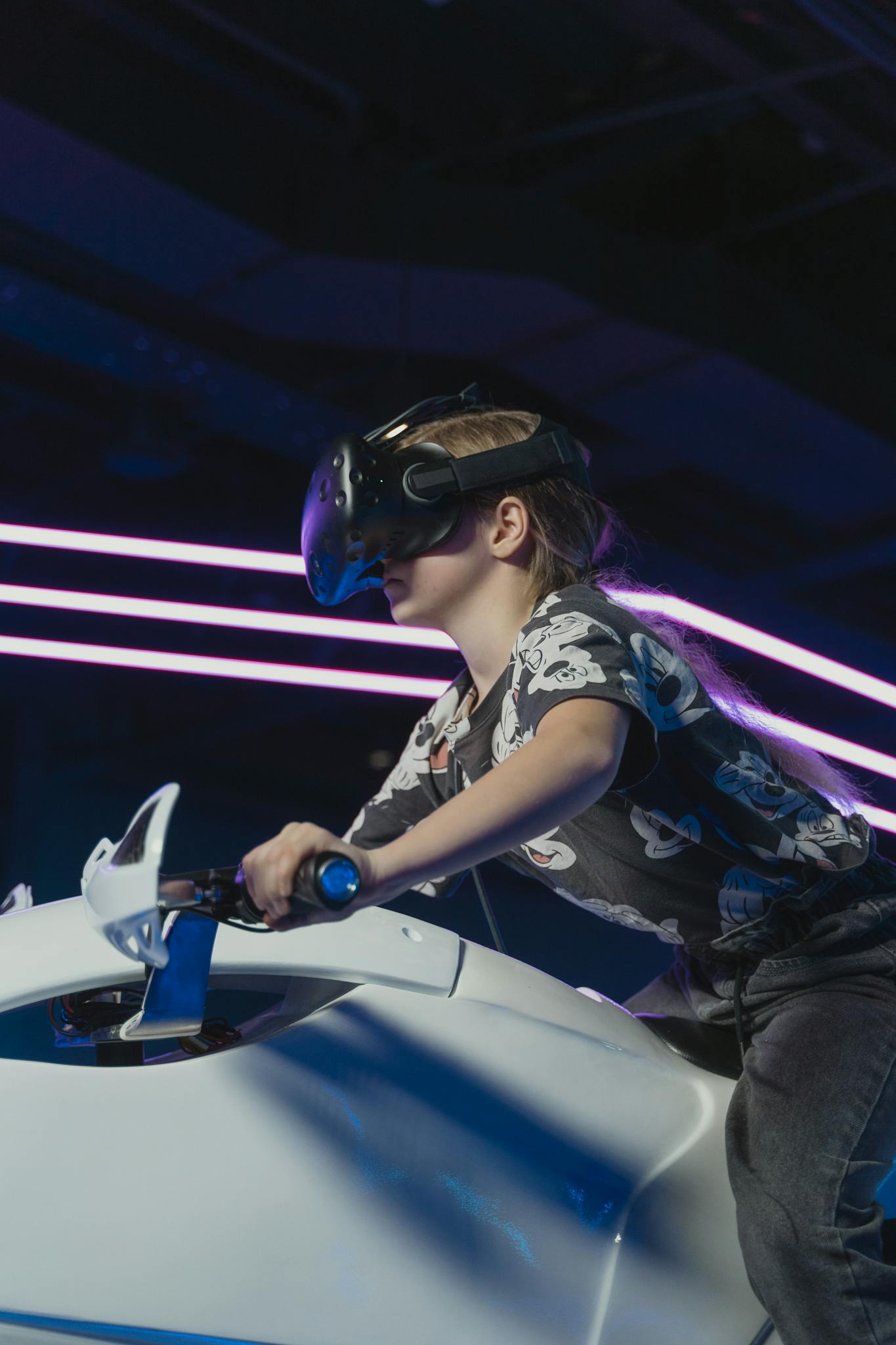 Young child enjoying an immersive virtual reality game indoors.